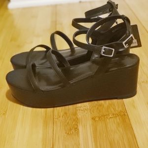 Strappy black wedge sandals
